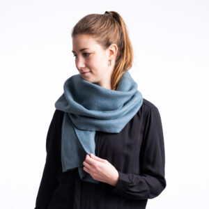 Winter scarf . A photo of a model wearing the vegan winter scaf in turquoise